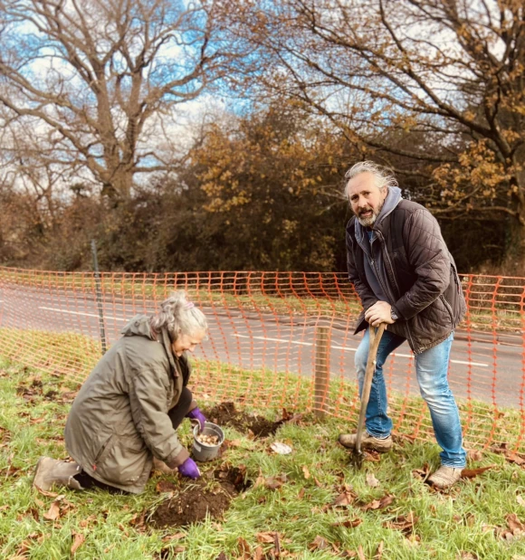 two people planting bulbs