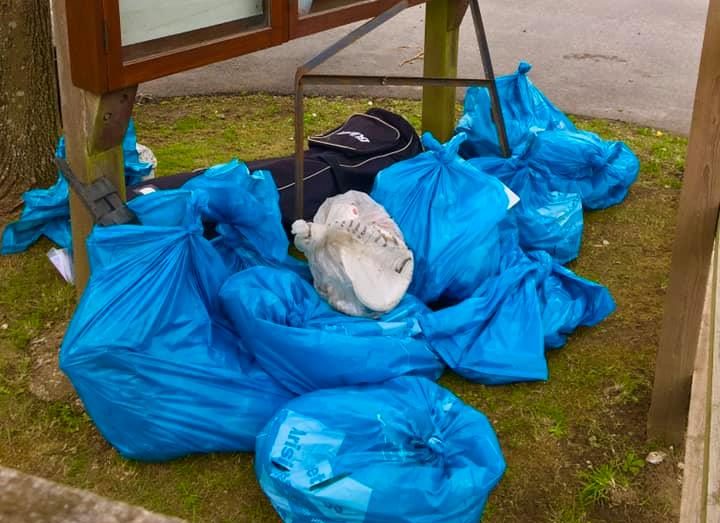 blue rubbish sacks piled up